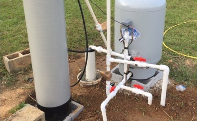 Commercial-grade filter and pressure tank installation