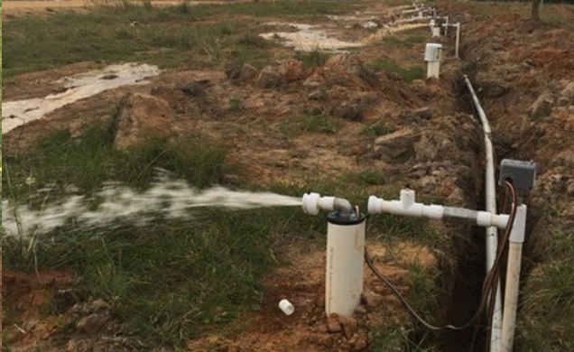 New water line being flushed after a well installation