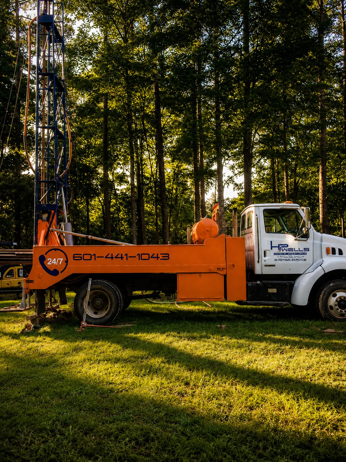 H&P Wells drill rig truck on a job site in the south Mississippi pines